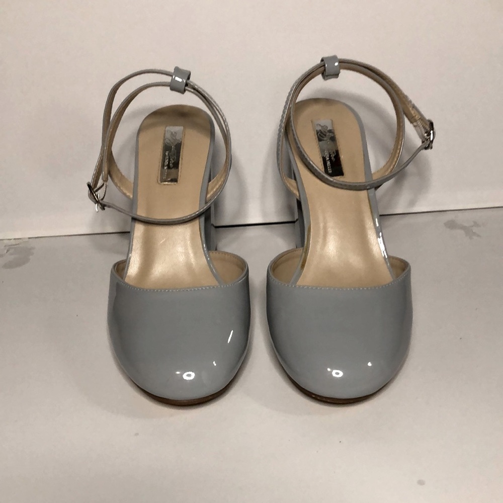 Powder blue closed toe heels. Ankle strap and angular heel. Gently worn
